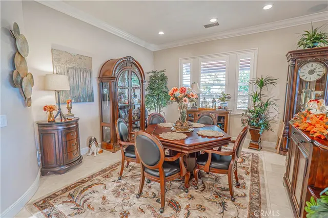 a living room with furniture a rug and a flat screen tv