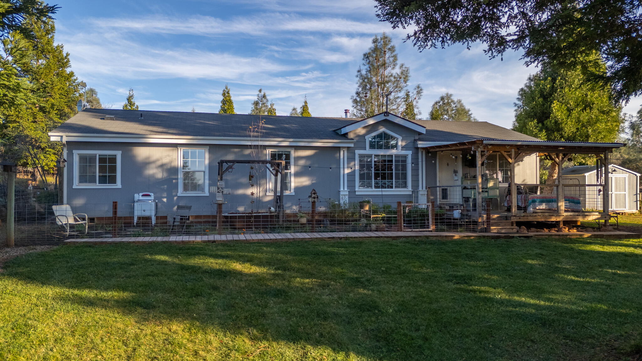32017 Rock Creek Road Manton, CA 96059 - Photo 2 of 57 a front view of a house with a yard table and chairs