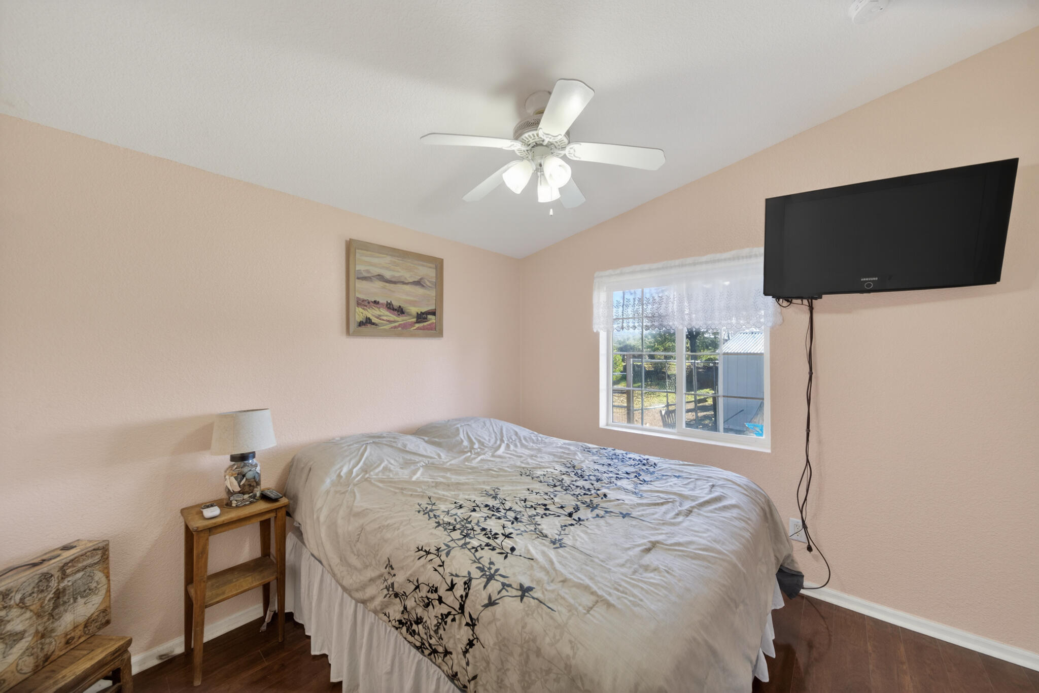 32017 Rock Creek Road Manton, CA 96059 - Photo 21 of 57 a bedroom with a bed and a flat screen tv