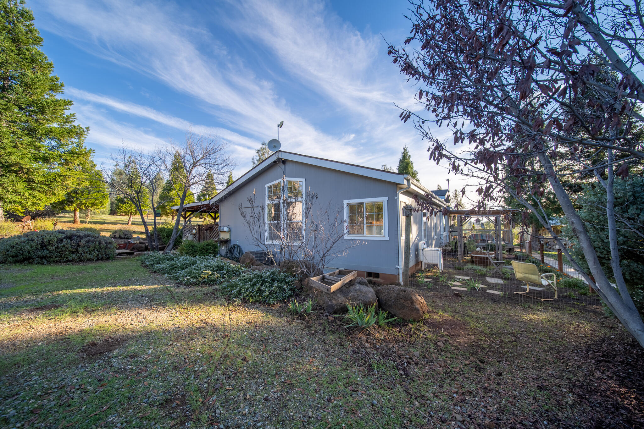 32017 Rock Creek Road Manton, CA 96059 - Photo 32 of 57 a view of a barn in the middle of a yard