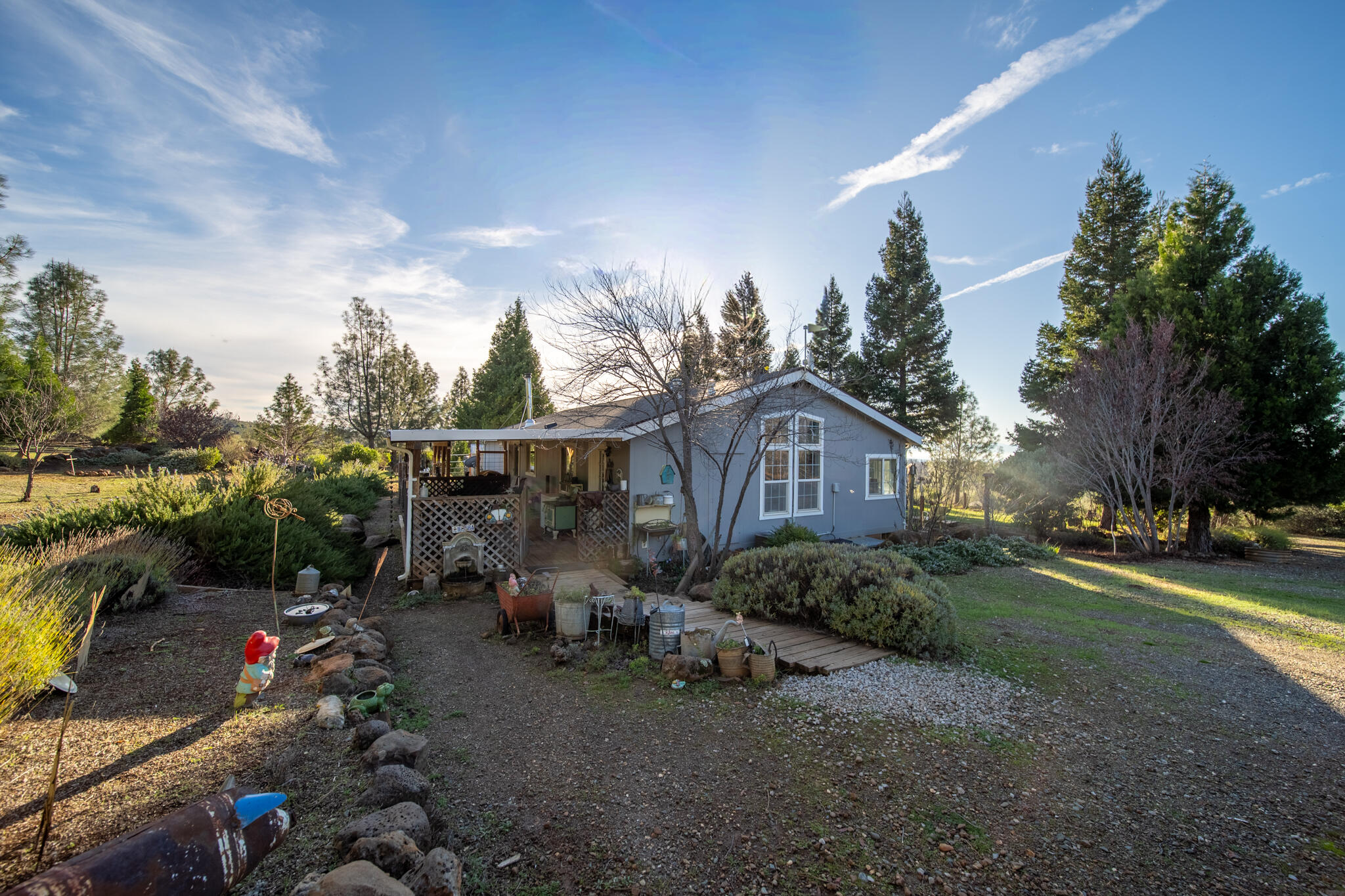 32017 Rock Creek Road Manton, CA 96059 - Photo 42 of 57 a view of a house with a garden