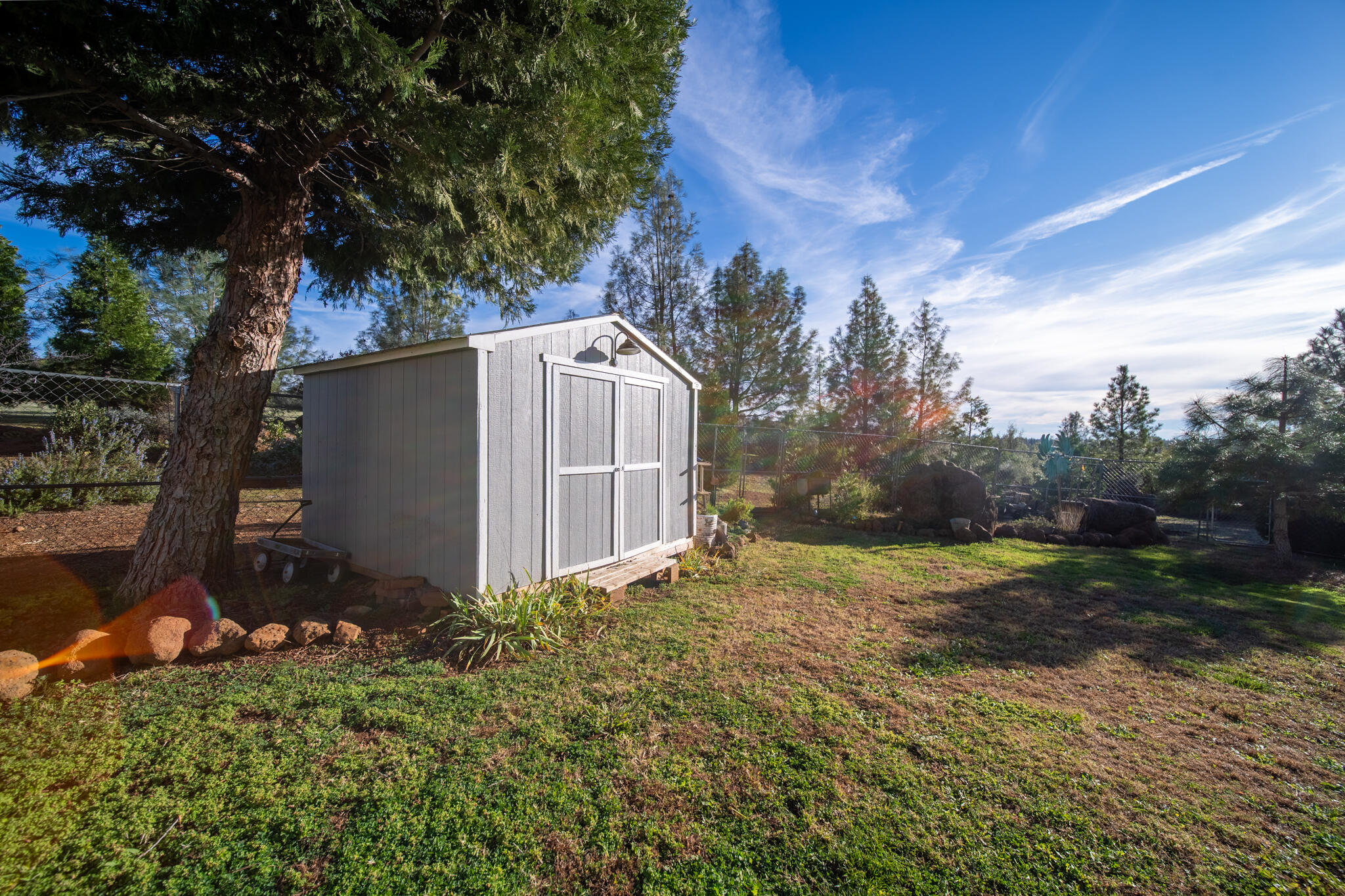 32017 Rock Creek Road Manton, CA 96059 - Photo 44 of 57 a backyard of a house with lots of green space