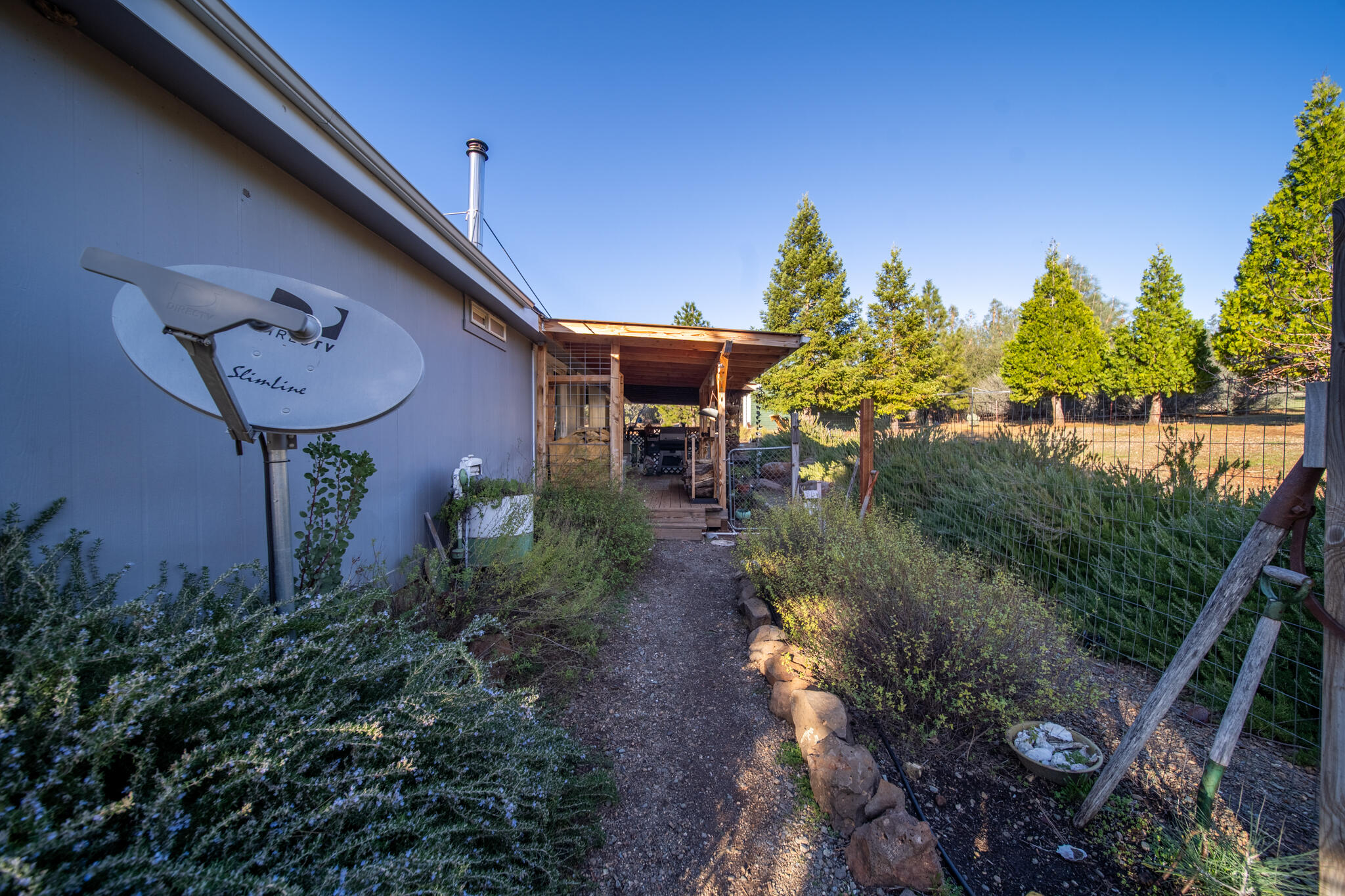 32017 Rock Creek Road Manton, CA 96059 - Photo 45 of 57 a view of a patio with plants and a table and chairs