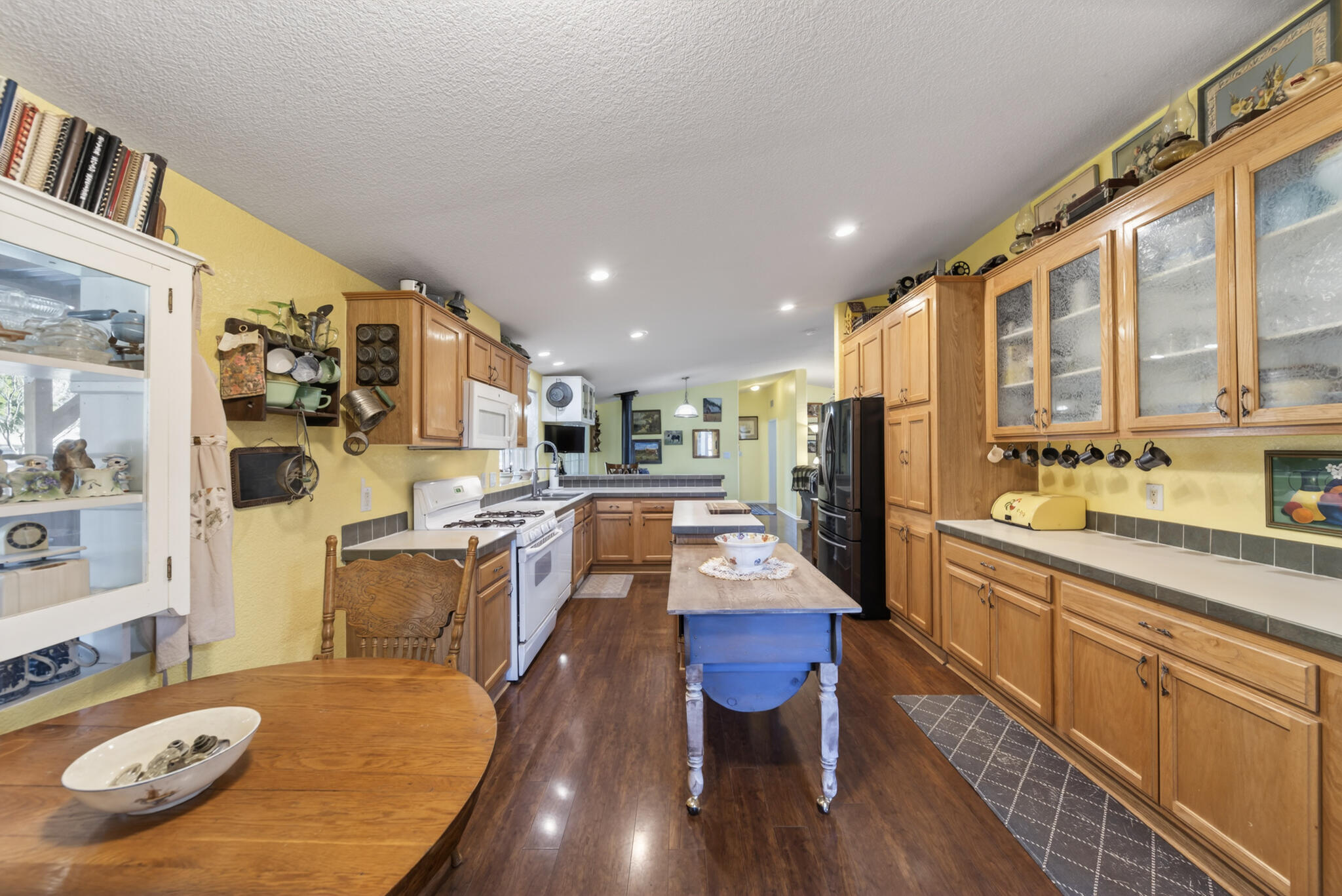32017 Rock Creek Road Manton, CA 96059 - Photo 6 of 57 a large kitchen with a table and chairs