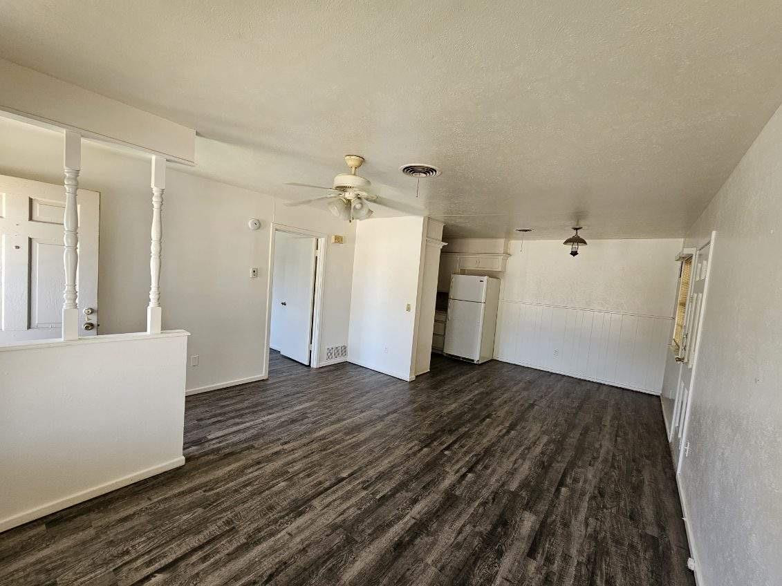 4201 50th Street, Unit A Lubbock, TX 79413 - Photo 3 of 7 a view of a livingroom with wooden floor