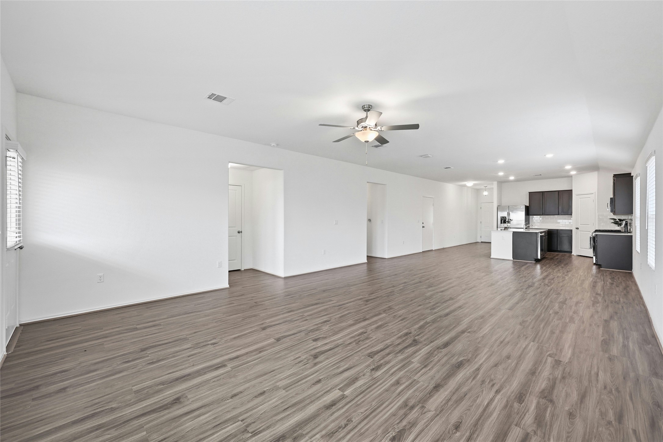 11813 Roscommon Trail Austin, TX 78754 - Photo 14 of 28 a view of an empty room with wooden floor