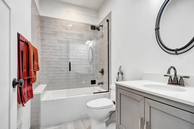 a bathroom with a sink toilet and shower