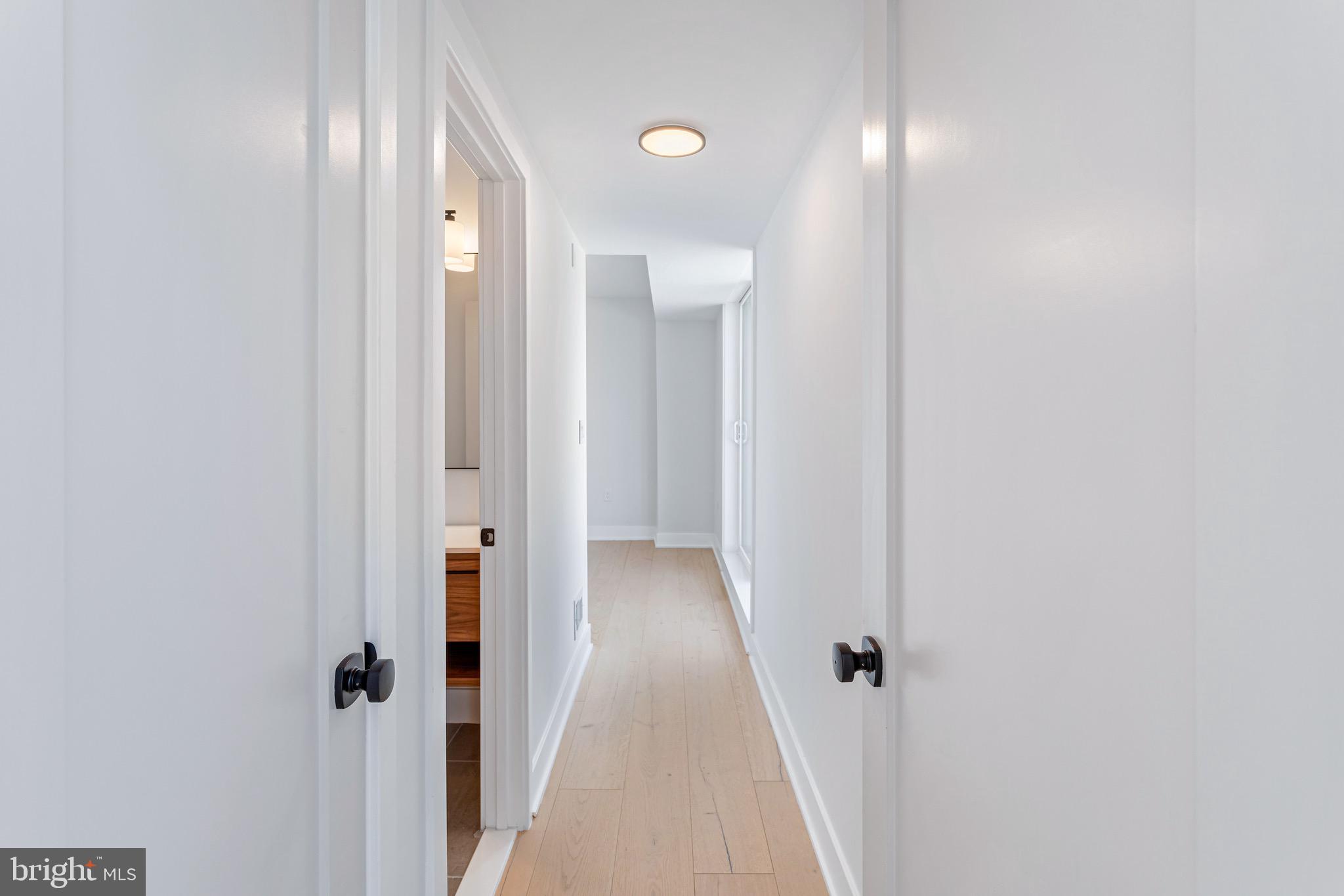 845 19th Street Northeast, Unit PH12 Washington, DC 20002 - Photo 15 of 24 a view of a hallway with wooden floor