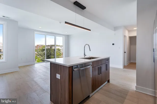 a kitchen with a stove and a window