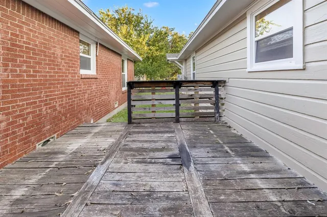an empty room with sliding glass door and mountain view