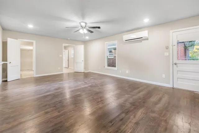 a bathroom with a tub and shower