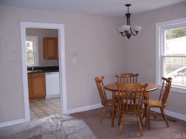 824 North King Charles Road Raleigh, NC 27610 - Photo 3 of 7 a view of a dining room with furniture and window