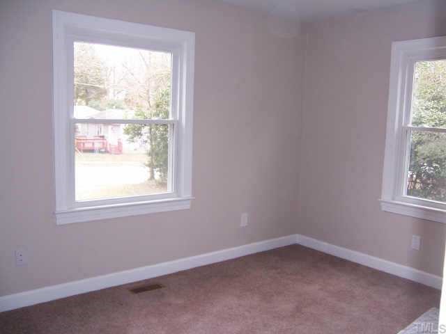 824 North King Charles Road Raleigh, NC 27610 - Photo 7 of 7 an empty room with a window