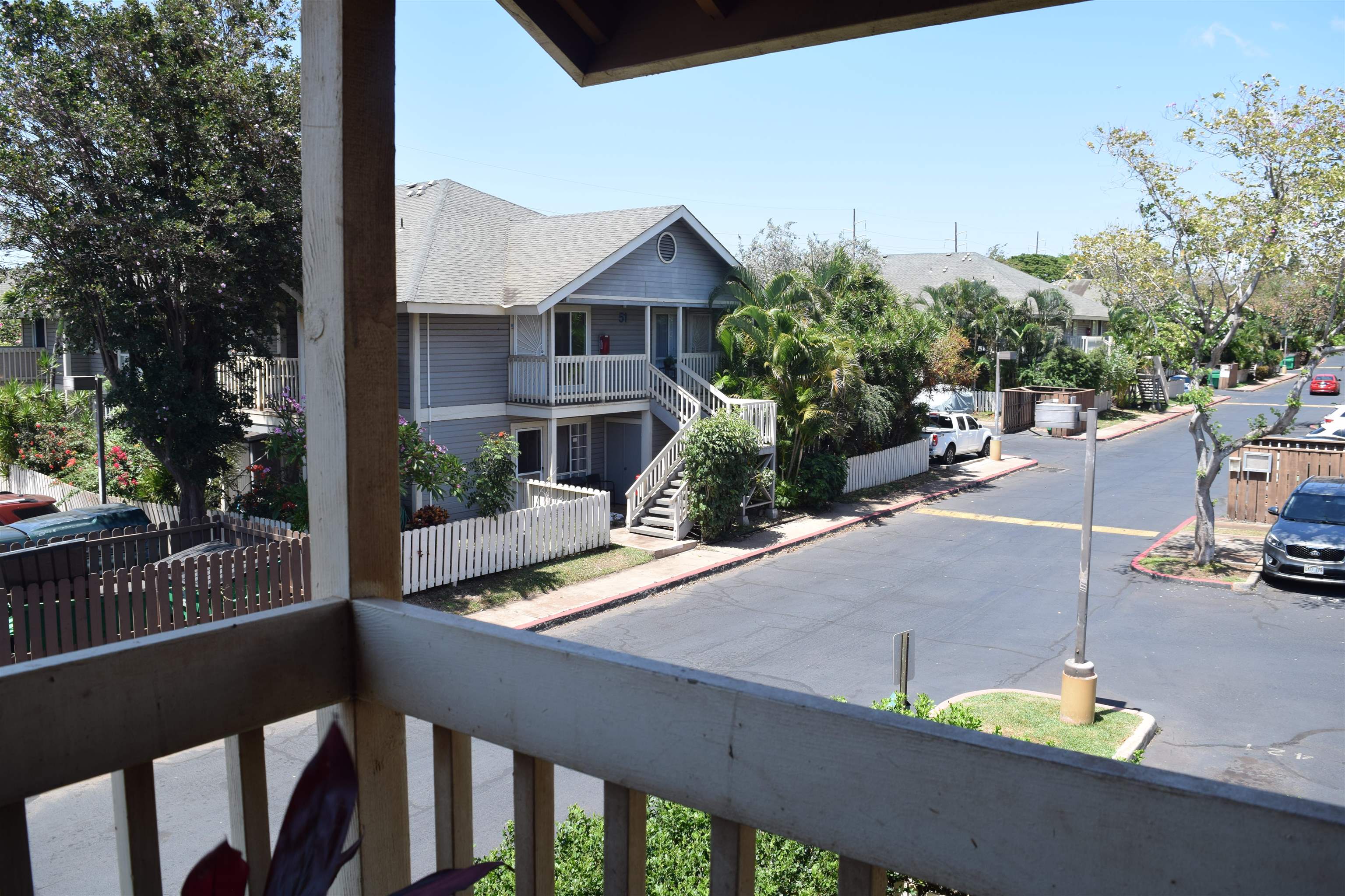 140 Uwapo Road, Unit 41203 Kihei, HI 96753 - Photo 15 of 17 a view of a house with backyard and sitting area