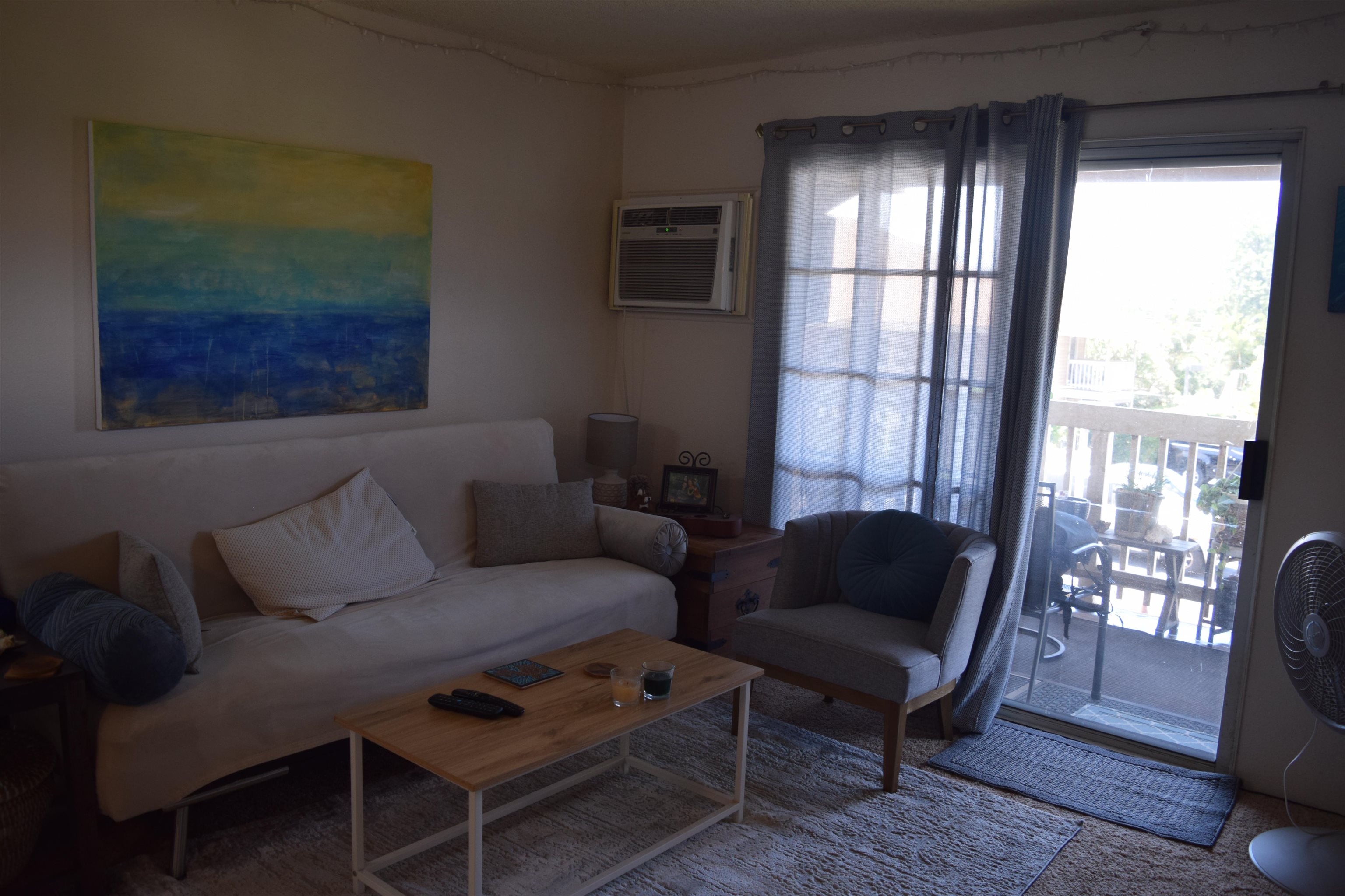 140 Uwapo Road, Unit 41203 Kihei, HI 96753 - Photo 7 of 17 a living room with furniture and a window