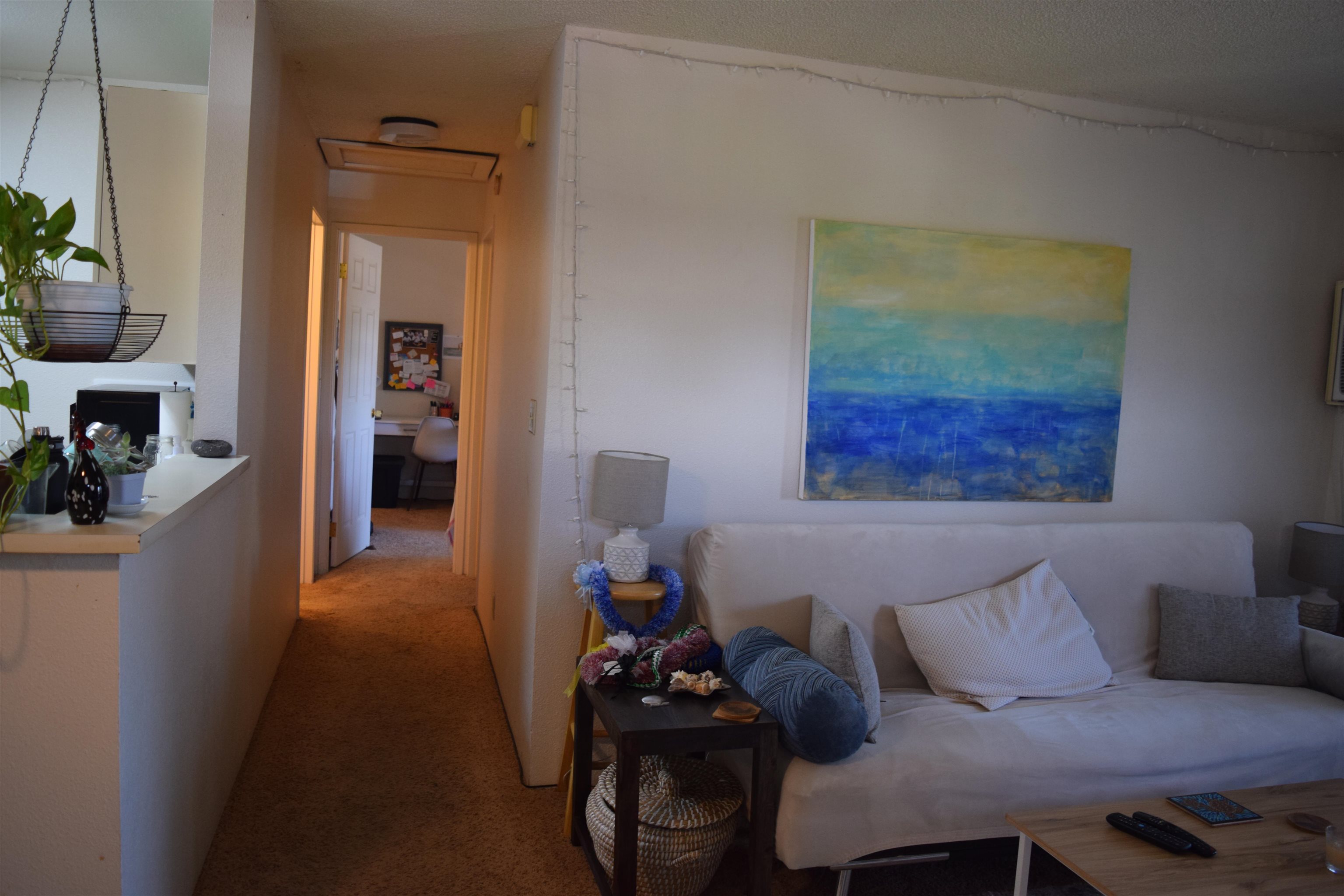 140 Uwapo Road, Unit 41203 Kihei, HI 96753 - Photo 8 of 17 a living room with furniture and a window