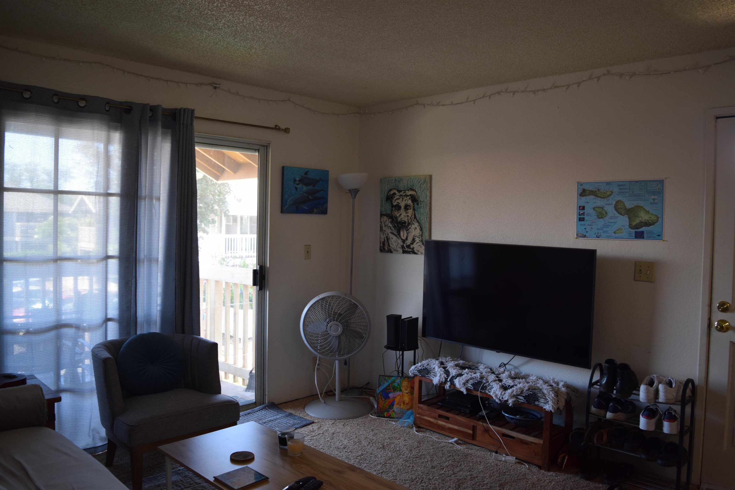 140 Uwapo Road, Unit 41203 Kihei, HI 96753 - Photo 9 of 17 a living room with furniture and a flat screen tv