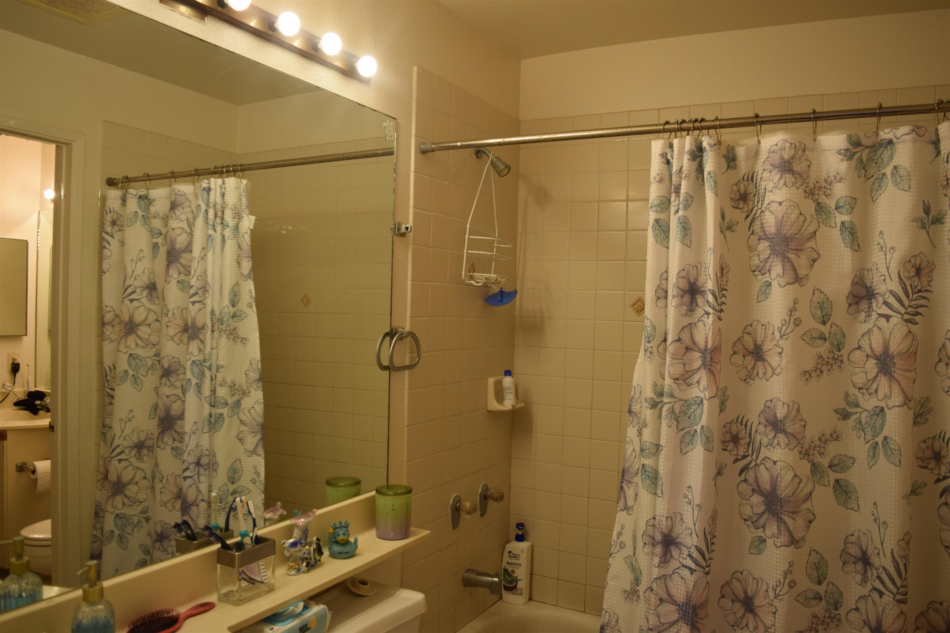 140 Uwapo Road, Unit 41203 Kihei, HI 96753 - Photo 10 of 17 a bathroom with a shower and a sink