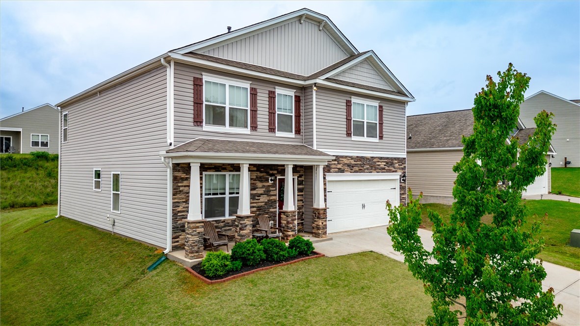 191 Light Spring Road Easley, SC 29642 - Photo 2 of 34 This two-story home features a welcoming covered porch, attached garage, and well-maintained landscaping.