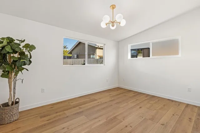 a view of an entryway with wooden floor