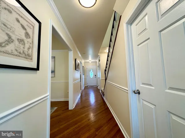 a view of an entryway with wooden floor