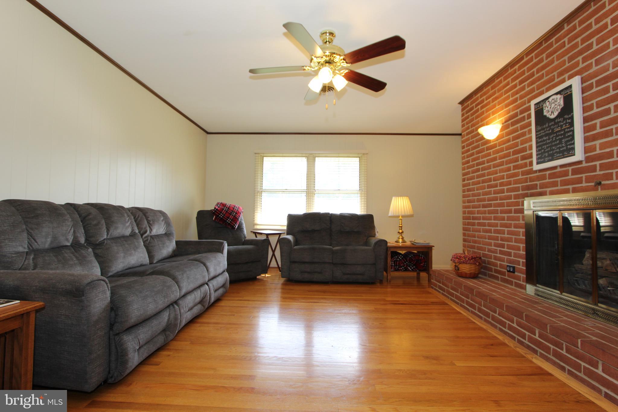 7914 Clearfield Road Frederick, MD 21702 - Photo 8 of 77 Family room has crown molding and ceiling fan