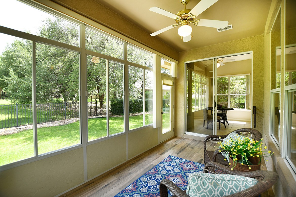 114 Lone Star Drive Georgetown, TX 78633 - Photo 17 of 30 A well-lit sunroom extends to a private yard, featuring durable wood-look tile flooring.