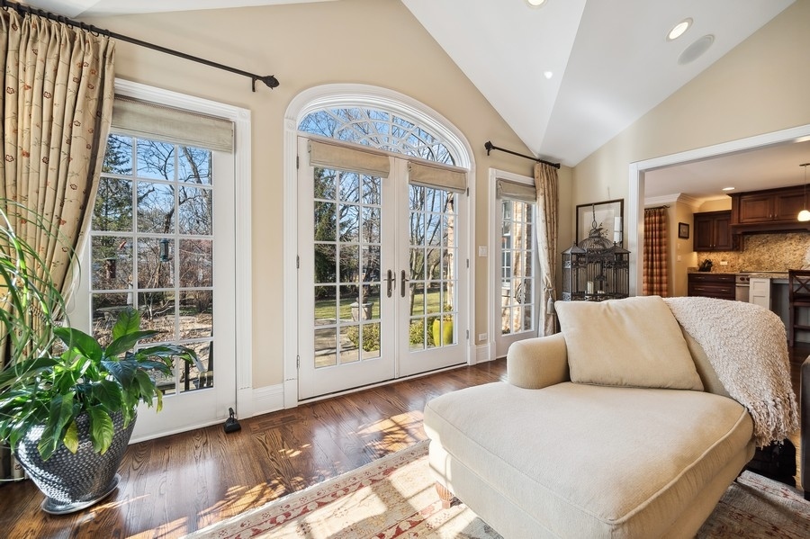 632 Chatham Road Glenview, IL 60025 - Photo 17 of 52 a living room with furniture large windows and wooden floor