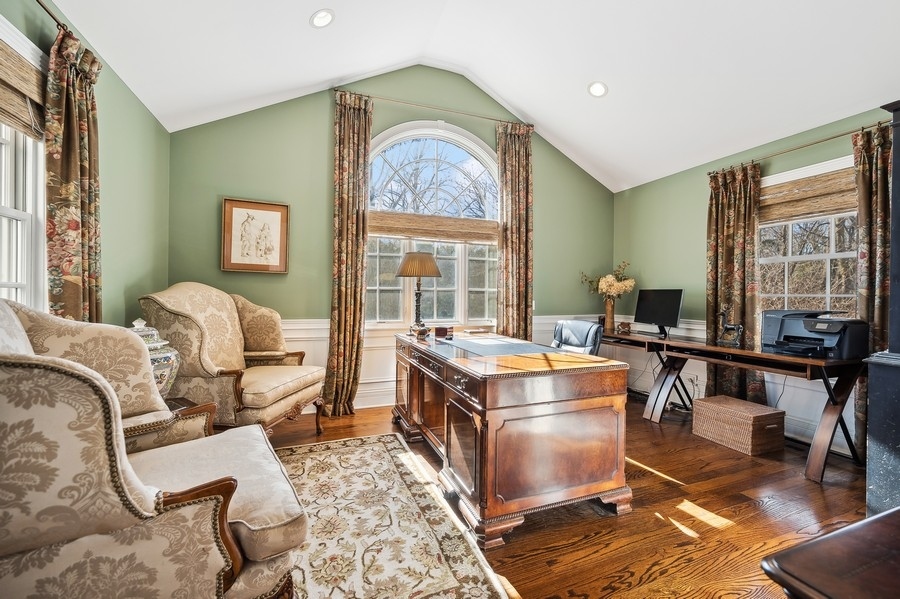 632 Chatham Road Glenview, IL 60025 - Photo 18 of 52 a living room with a couch and a table