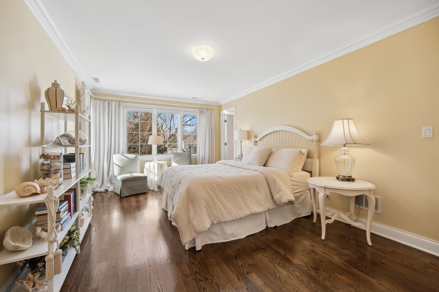 632 Chatham Road Glenview, IL 60025 - Photo 24 of 52 a bedroom with a bed wooden floor and a large window