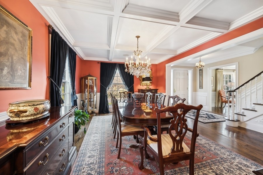 632 Chatham Road Glenview, IL 60025 - Photo 8 of 52 a dining room with furniture a chandelier and wooden floor