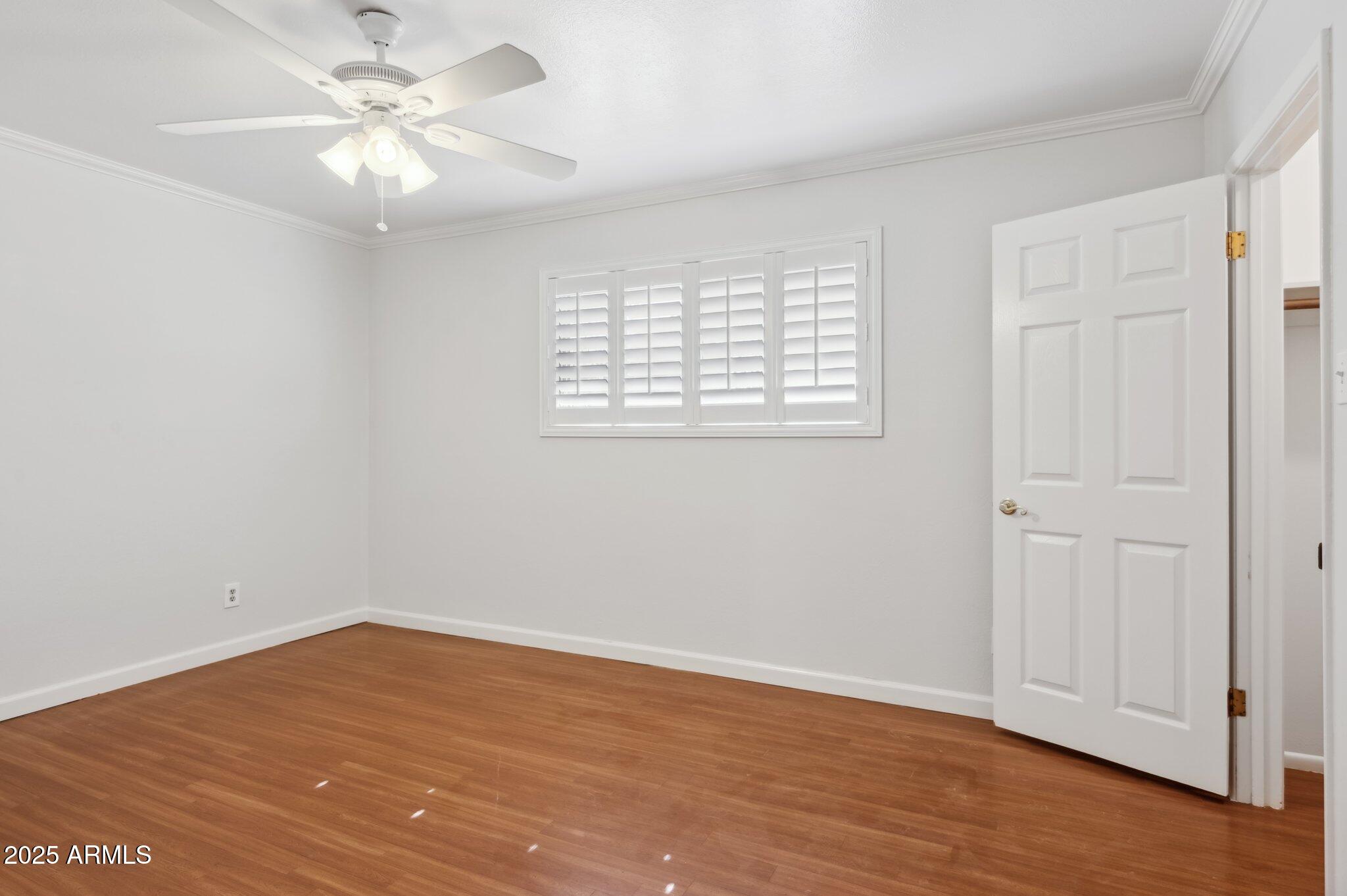 602 West Palmaire Avenue Phoenix, AZ 85021 - Photo 15 of 33 wooden floor in an empty room with a window