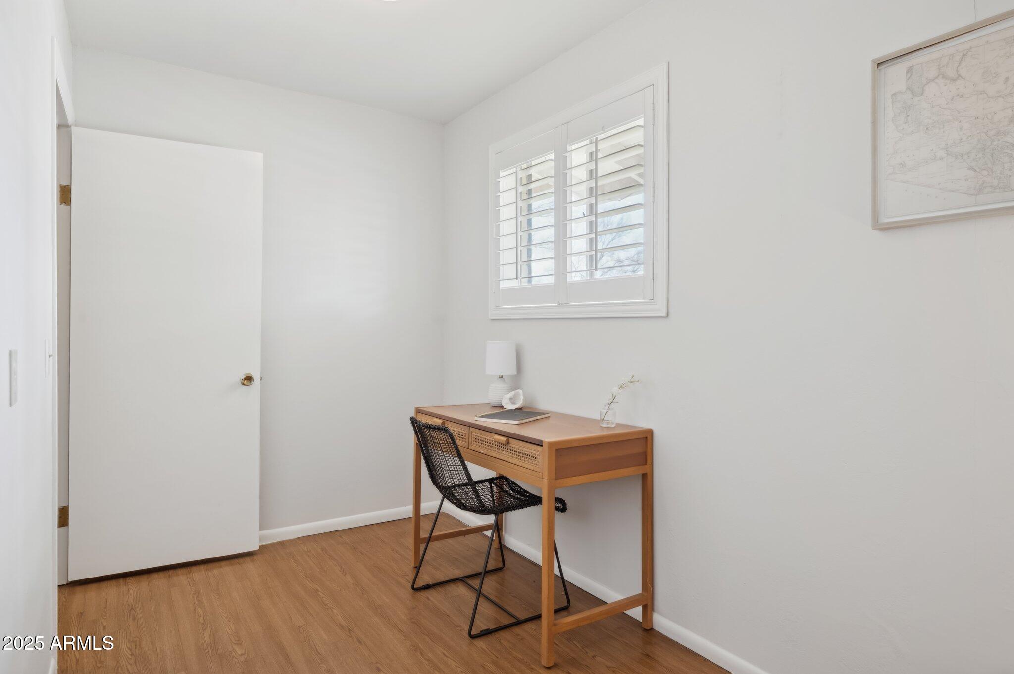 602 West Palmaire Avenue Phoenix, AZ 85021 - Photo 22 of 33 a view of a workspace with furniture and wooden floor