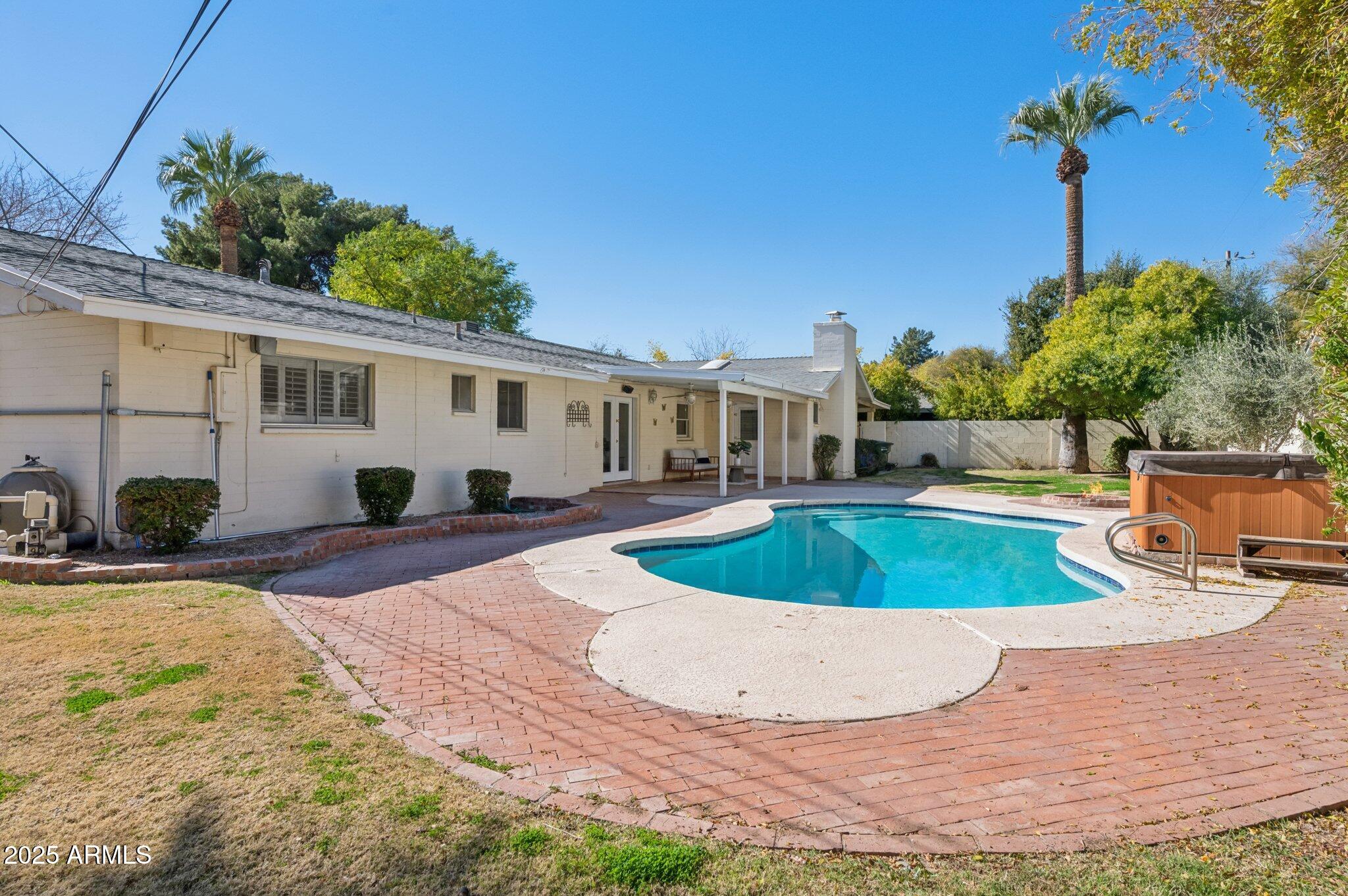 602 West Palmaire Avenue Phoenix, AZ 85021 - Photo 27 of 33 a view of a swimming pool with a patio