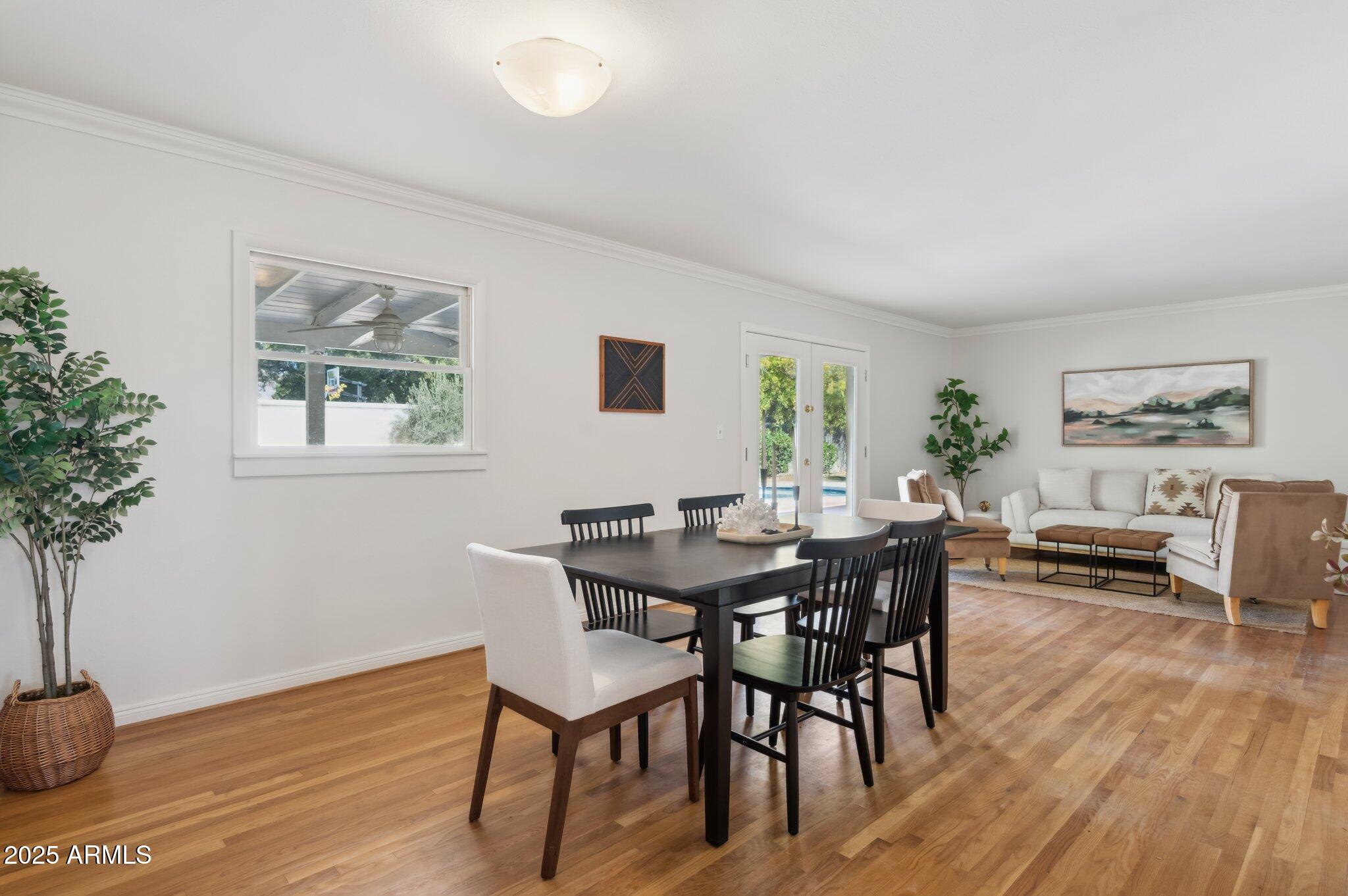 602 West Palmaire Avenue Phoenix, AZ 85021 - Photo 8 of 33 a view of a dining room with furniture and wooden floor