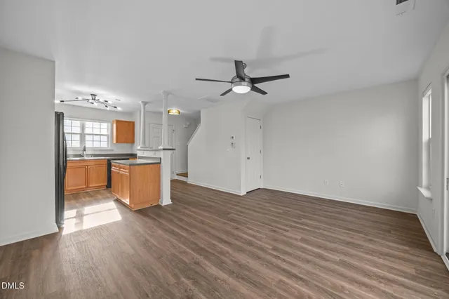 a view of a kitchen with wooden floor