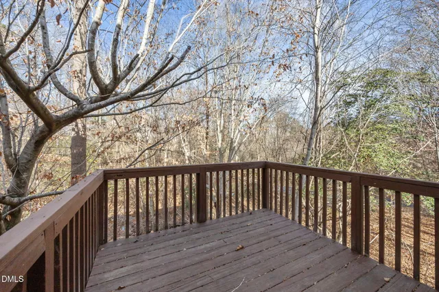 a view of a balcony with wooden floor