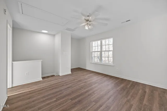 a view of wooden floor in an empty room