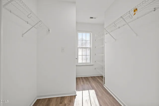a white bath tub sitting next to a window