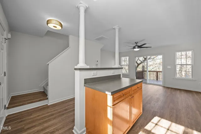 a kitchen with stainless steel appliances a stove microwave and sink