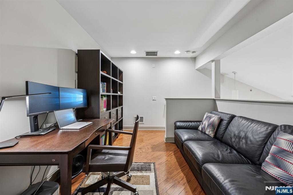 7400 River Road, Unit 409 North Bergen, NJ 07047 - Photo 17 of 30 a living room with furniture and a lamp