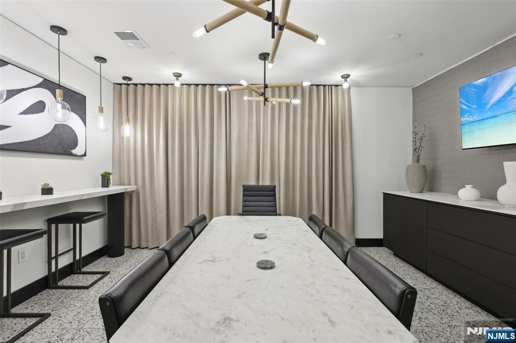 7400 River Road, Unit 409 North Bergen, NJ 07047 - Photo 20 of 30 a view of a bathroom with a sink and mirror