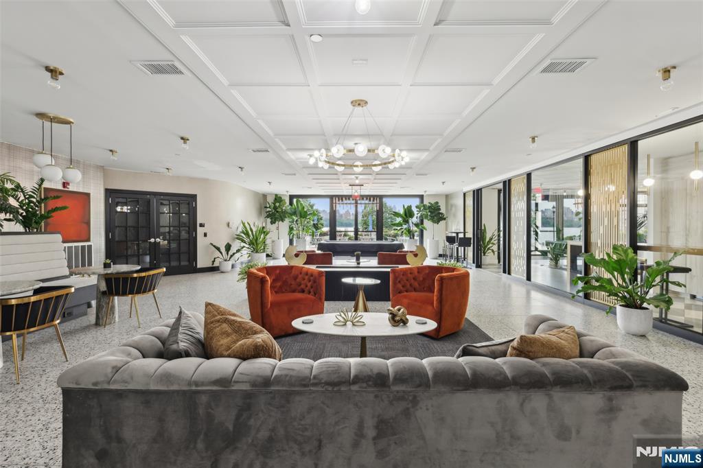 7400 River Road, Unit 409 North Bergen, NJ 07047 - Photo 22 of 30 a living room with furniture and a large window