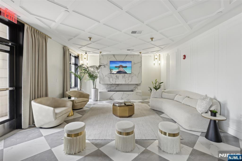 7400 River Road, Unit 409 North Bergen, NJ 07047 - Photo 23 of 30 a living room with furniture and a window