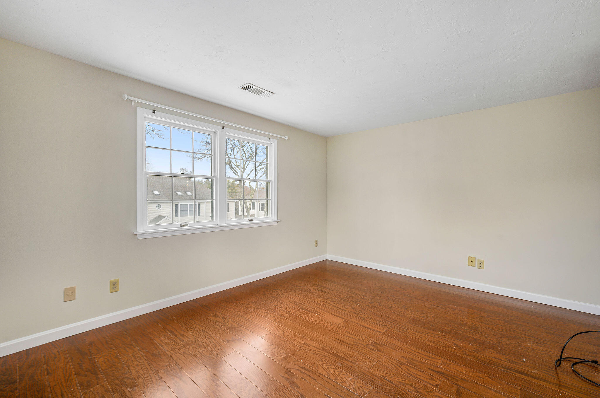 727 Main Street, Unit C3 Osterville, MA 02655 - Photo 17 of 23 wooden floor in an empty room with a window