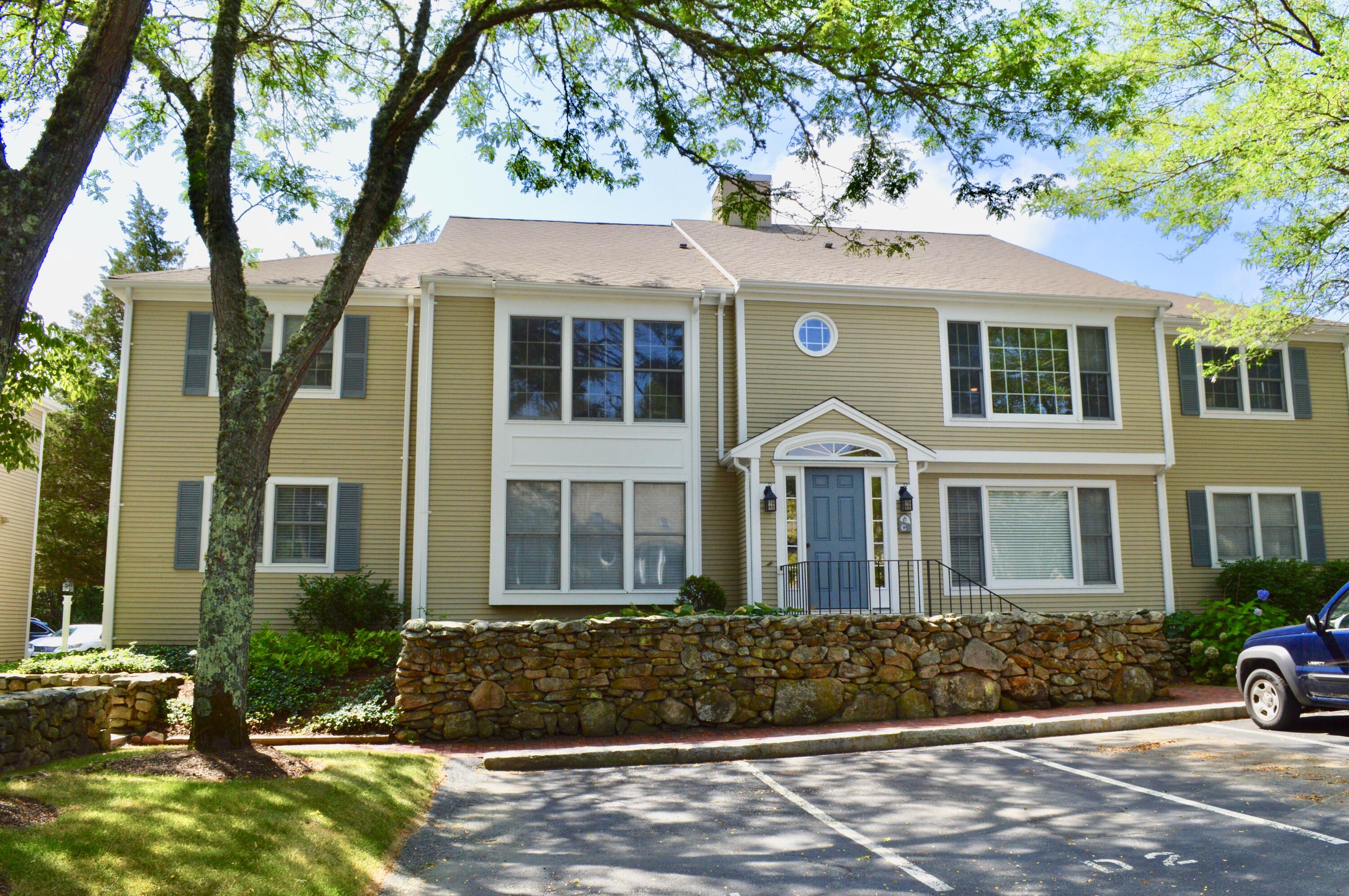 727 Main Street, Unit C3 Osterville, MA 02655 - Photo 23 of 23 a front view of a house with a garden