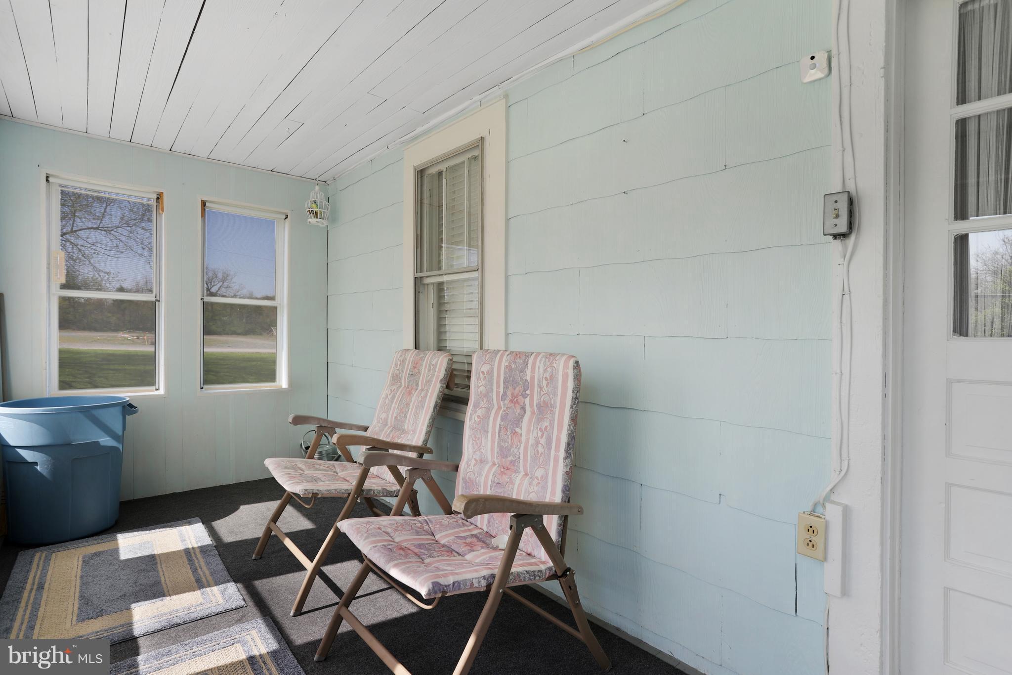 5593 Valley Road Berkeley Springs, WV 25411 - Photo 5 of 26 Screened in back porch