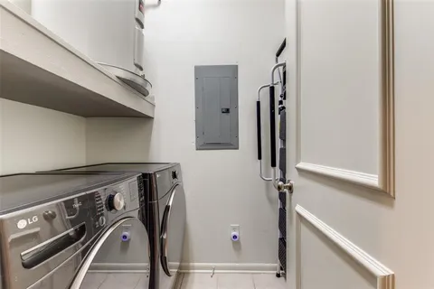 a view of storage and utility room with washer and dryer