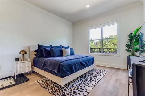 a bedroom with bed and a window