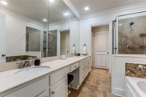 a bathroom with a double vanity sink mirror and double